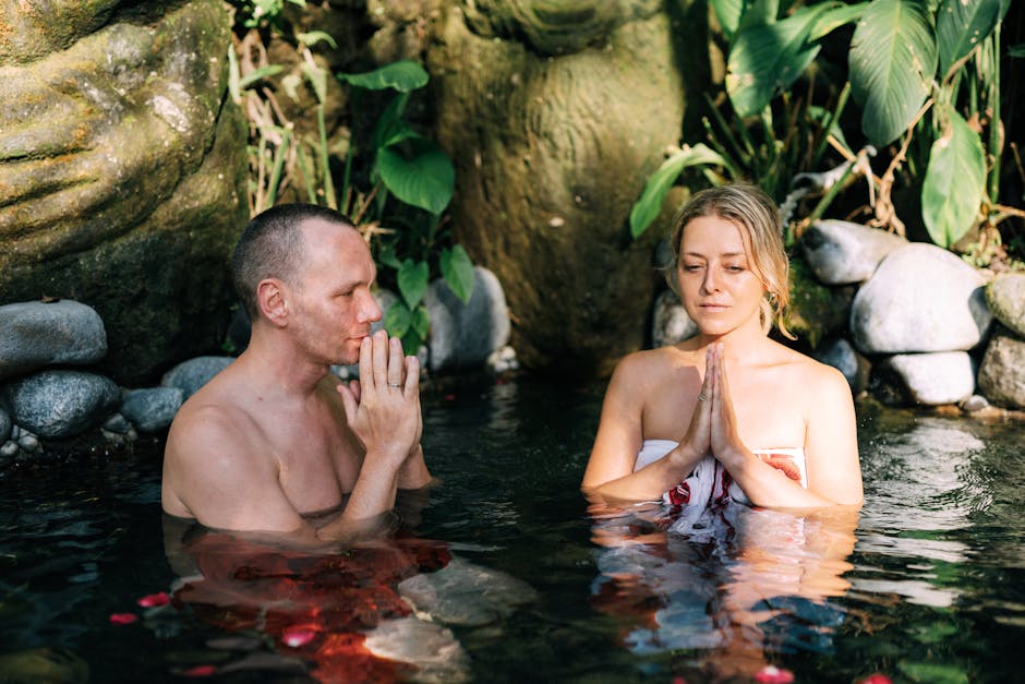 couple meditating in a serene garden at a wellness retreat - 30 year anniversary trip ideas